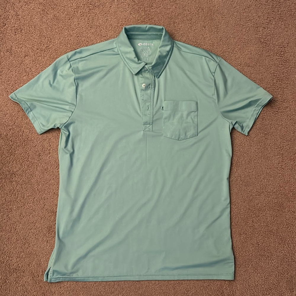Mens’s Costa s/s polo shirt. Size = medium. Color = aqua blue/green.